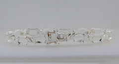 Sterling silver semi mount tennis bracelet setting with oval stones, featuring durable stainless steel tongue for longevity.