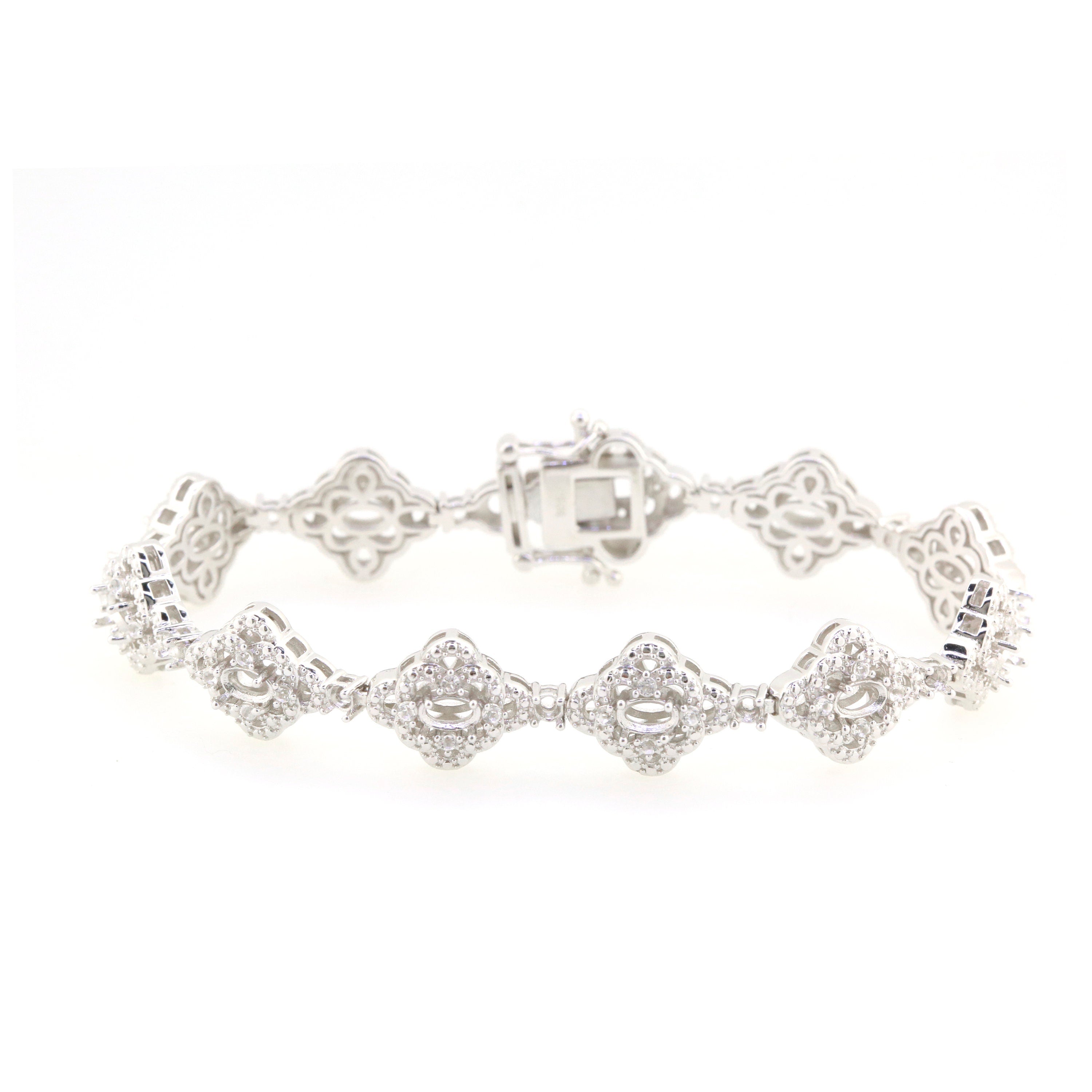 Sterling Silver Semi Mount Tennis Bracelet Setting with Oval Halo and White Topaz accents, elegant jewelry piece.