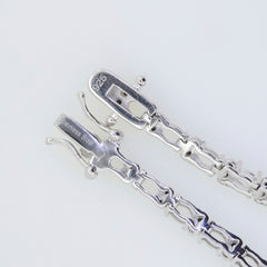 Close-up of a sterling silver semi mount tennis bracelet setting with stainless steel tongue clasp.