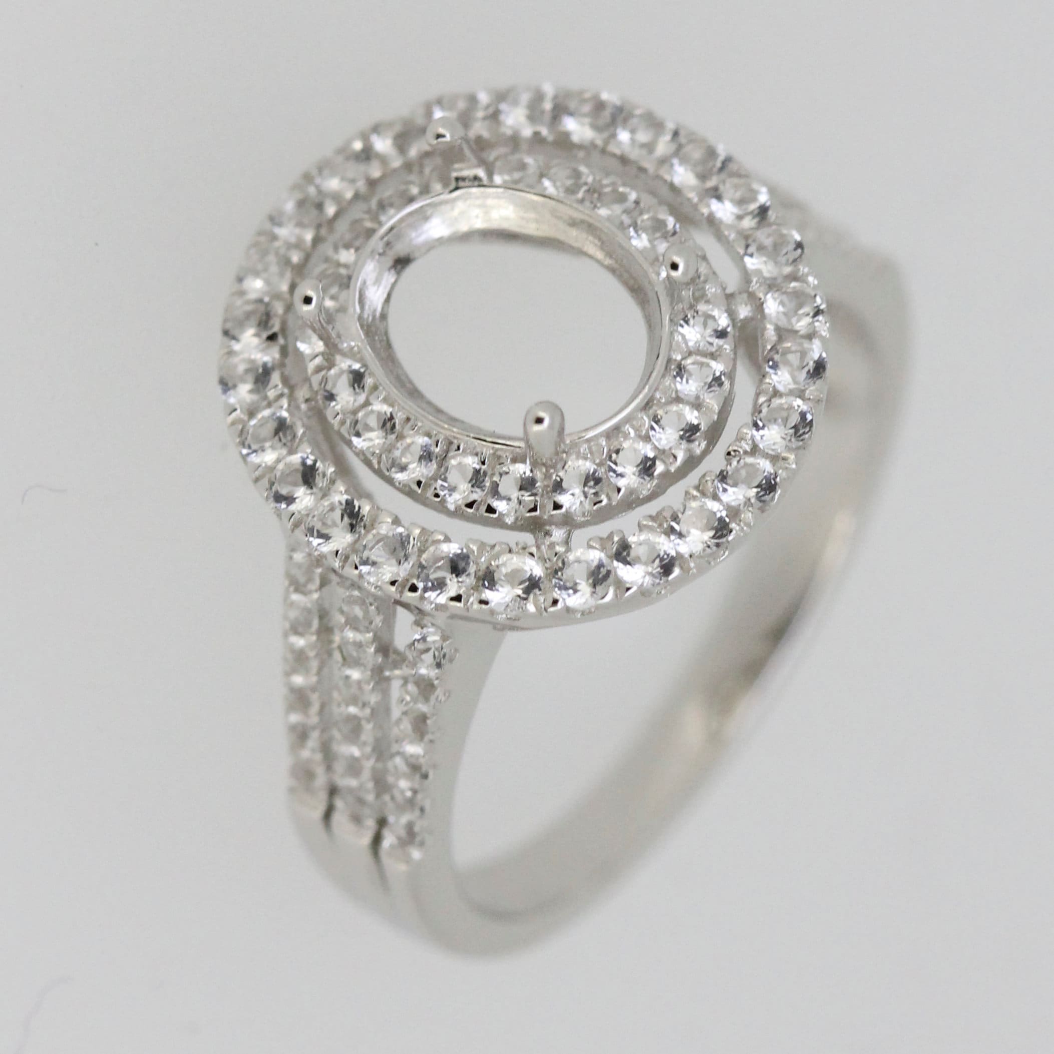 Custom Sterling Silver Semi Mount Ring Setting with Oval Halo and White Topaz Accents for 7x5mm stone.