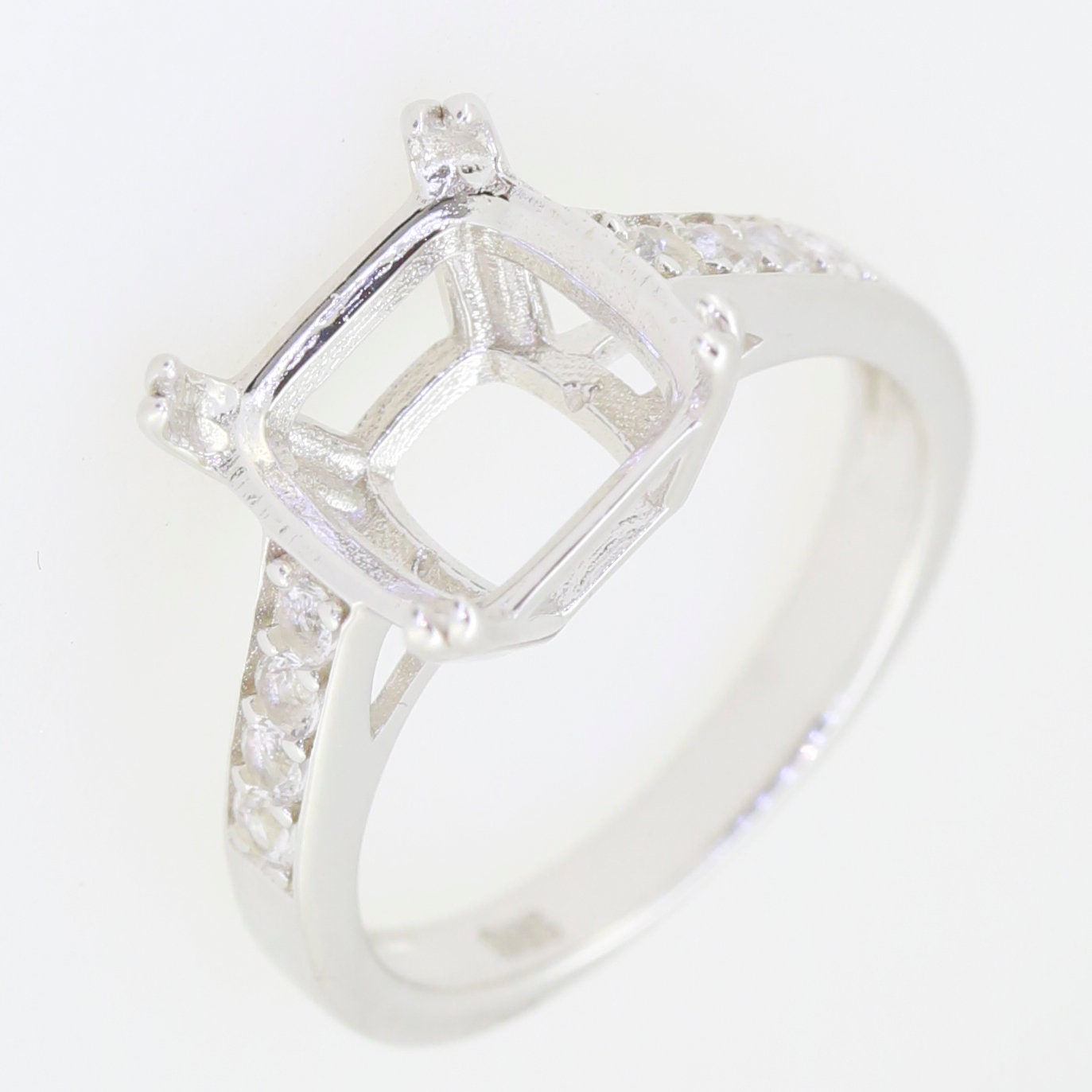 Sterling silver semi mount ring setting with cushion halo and moissanite accents, ready for gemstone customization.