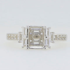 Sterling silver semi mount ring setting with emerald halo and white topaz accents, designed for customizable options.