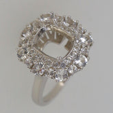 Sterling silver semi mount ring setting with halo of white topaz accents, designed for a 10x8mm cushion gem.