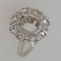 Sterling silver semi mount ring setting with halo of white topaz accents, designed for a 10x8mm cushion gem.