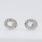 Sterling Silver semi mount earrings setting with oval shape, featuring sparkling white topaz gemstones.