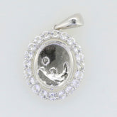 Sterling silver semi mount pendant setting with halo of white topaz cabochons, designed for custom gemstones.