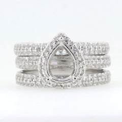 3 piece sterling silver semi mount ring setting with pear shaped design and moissanite accents.