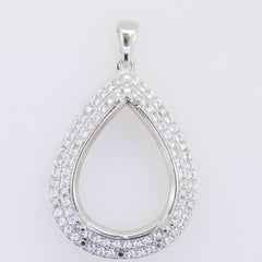 Sterling silver semi mount pendant setting in teardrop shape, adorned with sparkling white topaz gemstones.