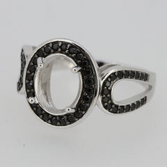 Sterling Silver semi mount ring setting with black spinel accents, featuring an oval opening for a gemstone.