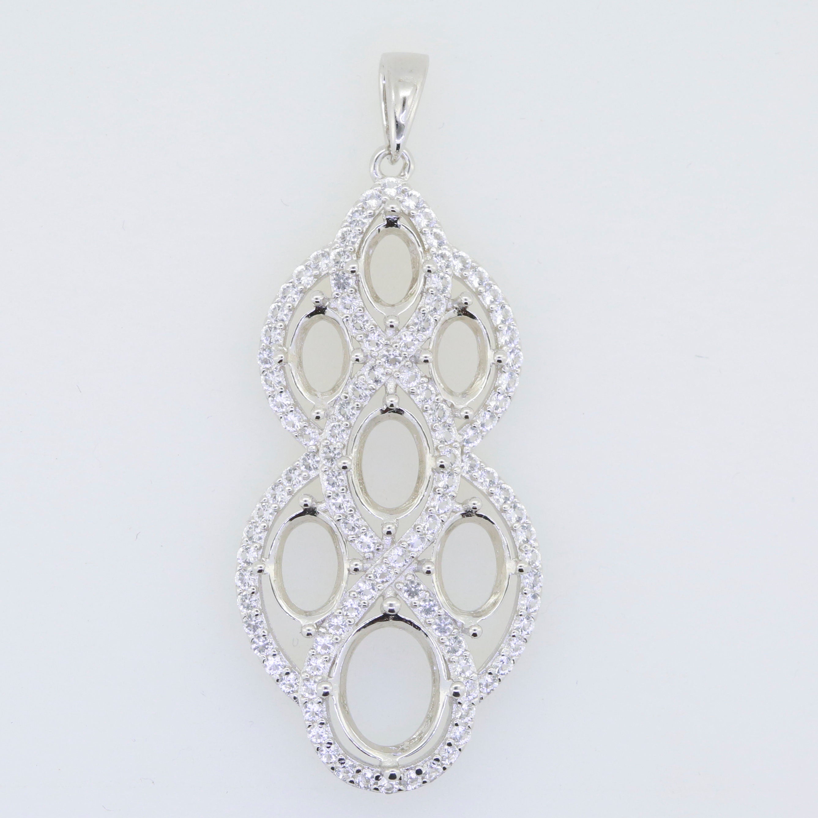 Sterling silver semi mount pendant setting with oval cutouts for White Topaz gemstones, versatile for various sizes.