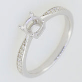 Sterling silver semi mount ring setting with round 5x5mm centerpiece and Moissanite accents, ideal for custom designs.