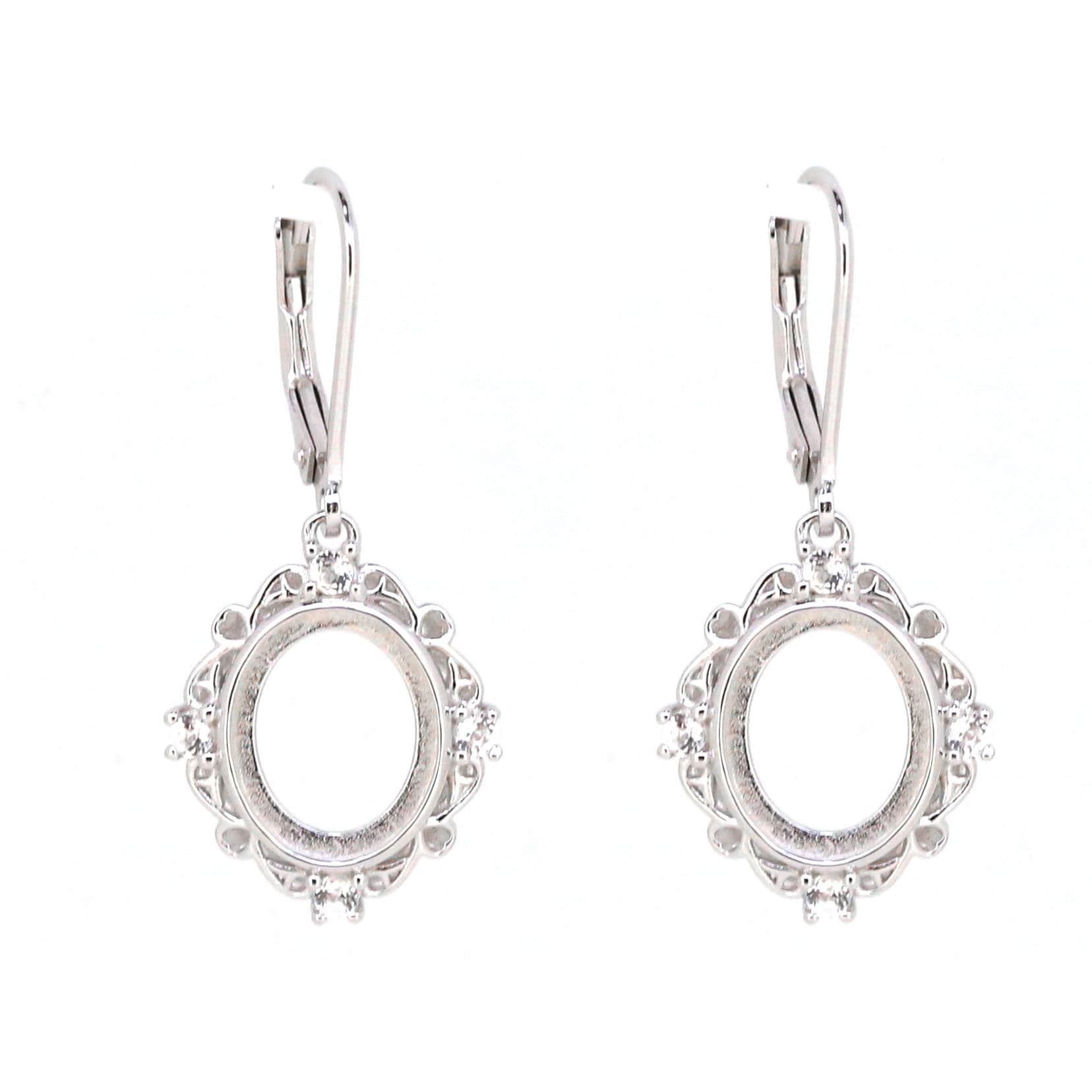 Sterling silver semi mount earrings with oval setting for cabochon, featuring white topaz accents and leverback closure.