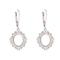 Sterling silver semi mount earrings with oval setting for cabochon, featuring white topaz accents and leverback closure.