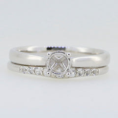 Sterling silver semi mount engagement ring setting with round 5x5mm center stone and sparkling accents.