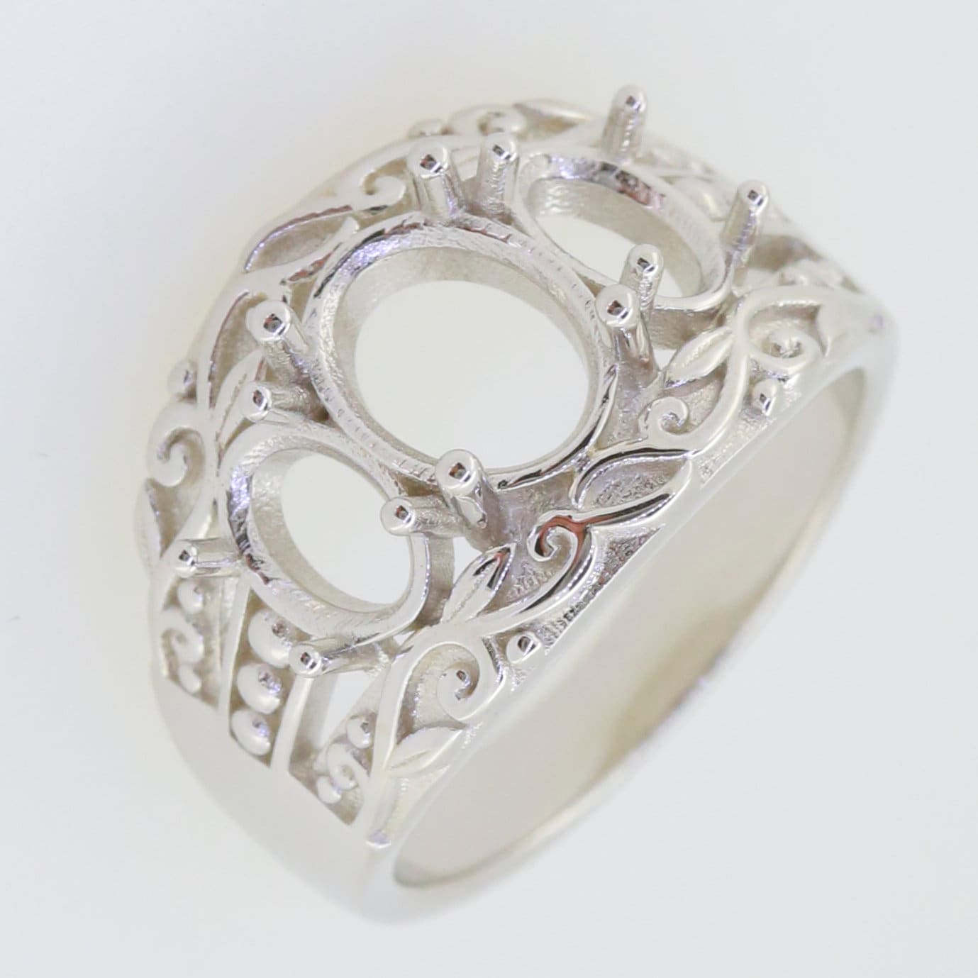 Sterling Silver Semi Mount Ring Setting with intricate design for three stones, ready for customization.
