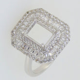 Sterling silver semi mount ring setting featuring baguette and halo design with clear topaz gemstones.