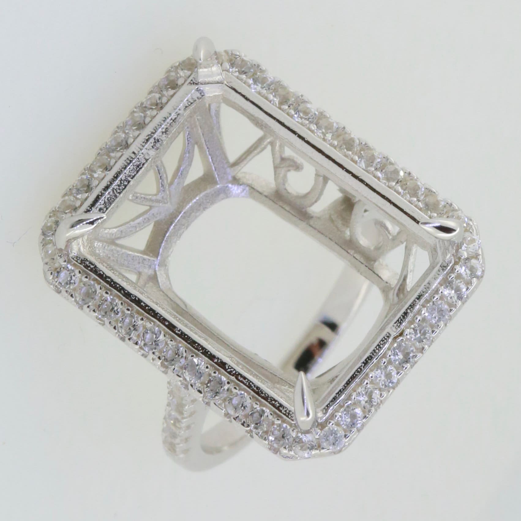 Sterling Silver semi mount ring setting with white topaz halo, designed for an emerald gemstone, elegant and customizable.