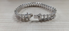 Sterling silver semi mount tennis bracelet setting, featuring a secure clasp and elegant design for custom gemstone options.
