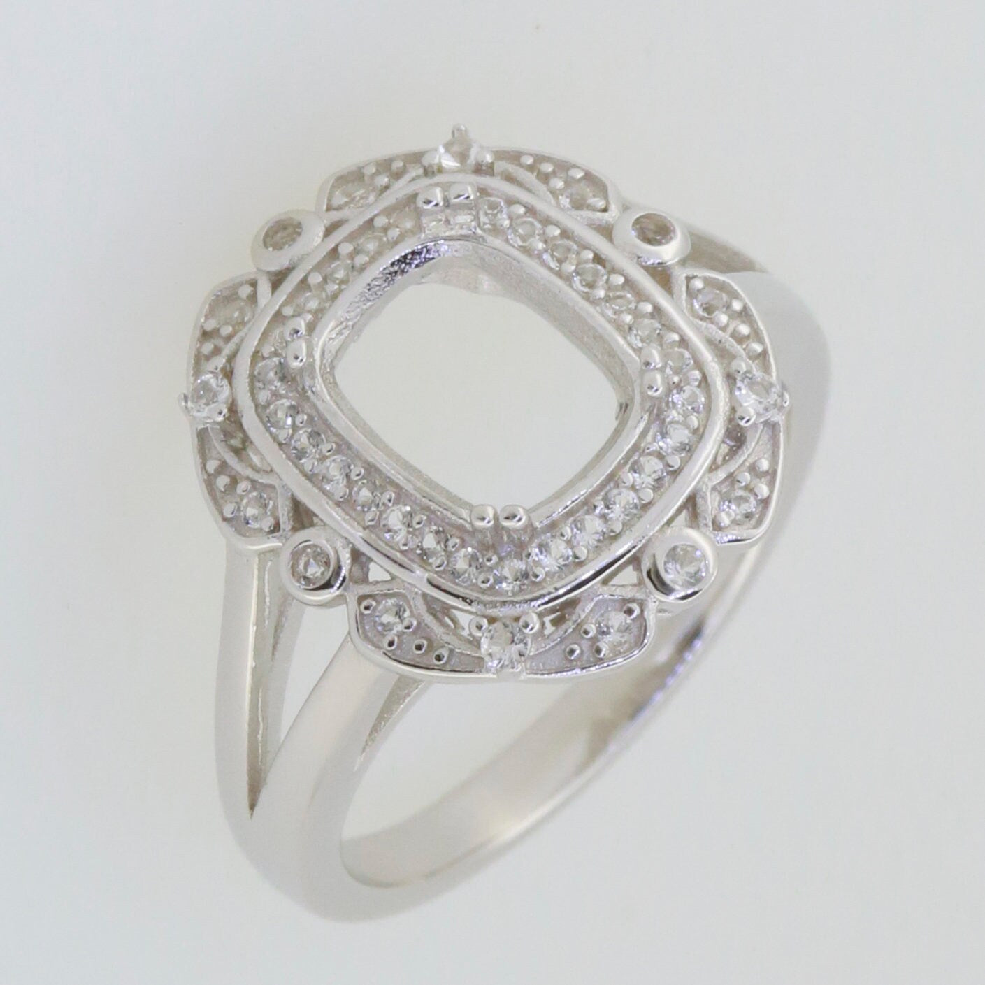 Sterling silver semi mount cushion ring setting with white topaz accents, customizable for various sizes.