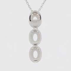 Sterling Silver semi mount pendant setting with three oval openings for gemstones, marked 925, on a delicate chain.