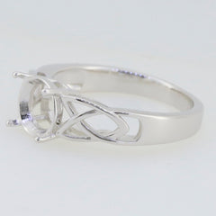Sterling silver semi mount ring setting with cross shank and Celtic knot design, ready for customizable gemstones.