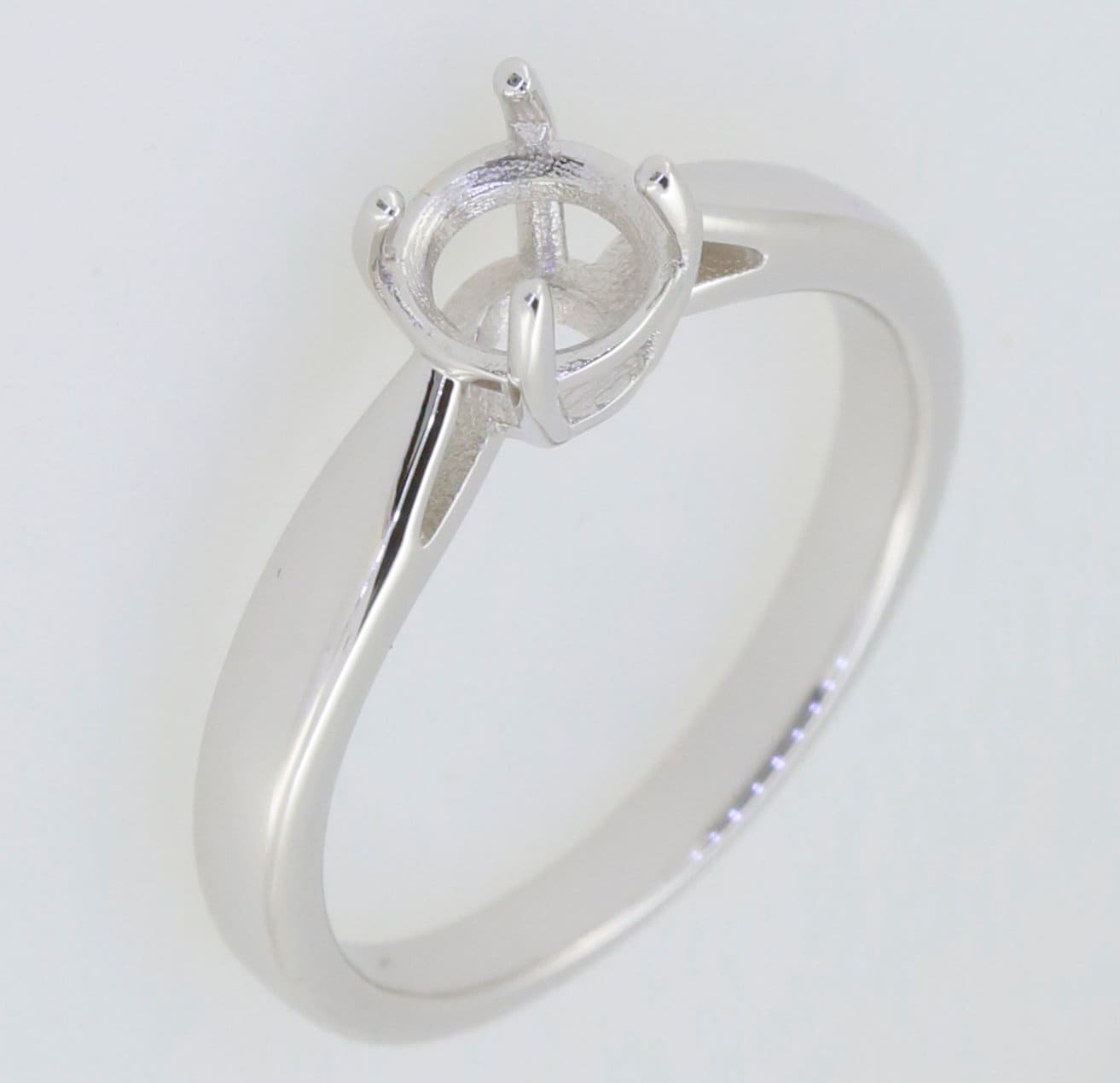 Sterling silver semi mount ring setting with round 6.5x6.5mm solitaire, perfect for custom jewelry designs.