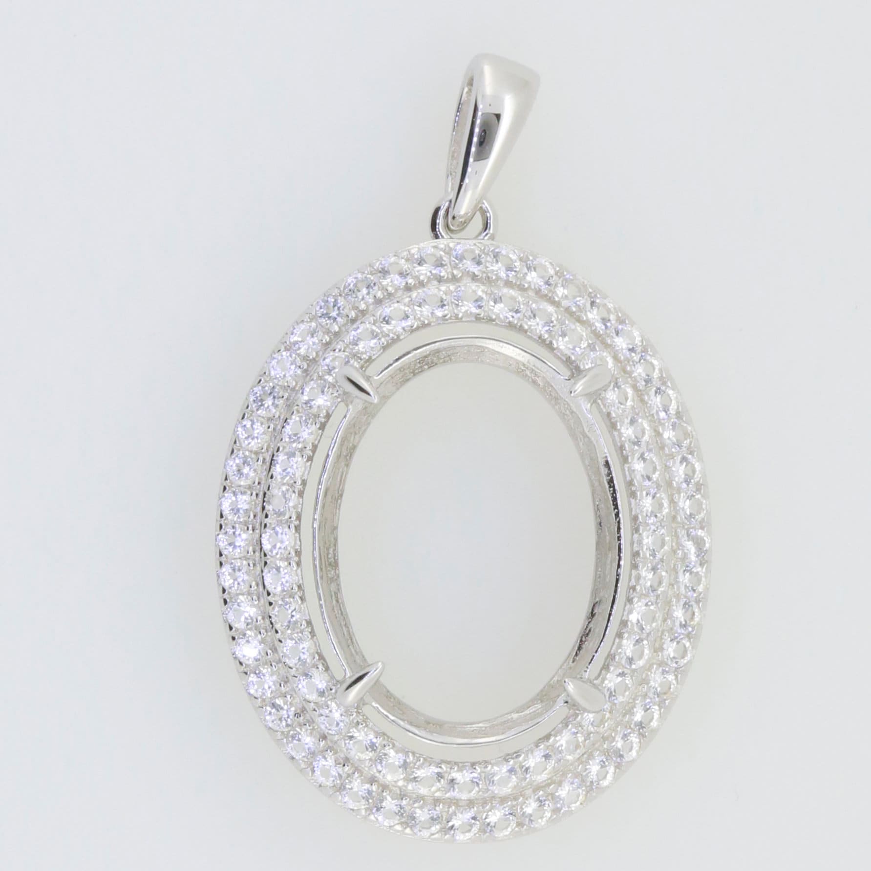 Sterling silver semi mount oval pendant setting with double halo of white topaz, made to order for custom gemstones.