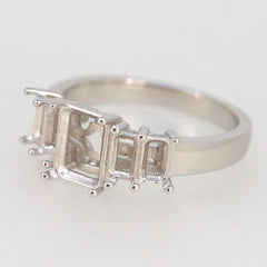 Sterling silver semi mount ring setting for emerald stones, designed for custom orders, featuring four prongs.