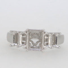 Sterling silver semi mount ring setting featuring emerald-shaped stones, designed for custom gemstone placement.