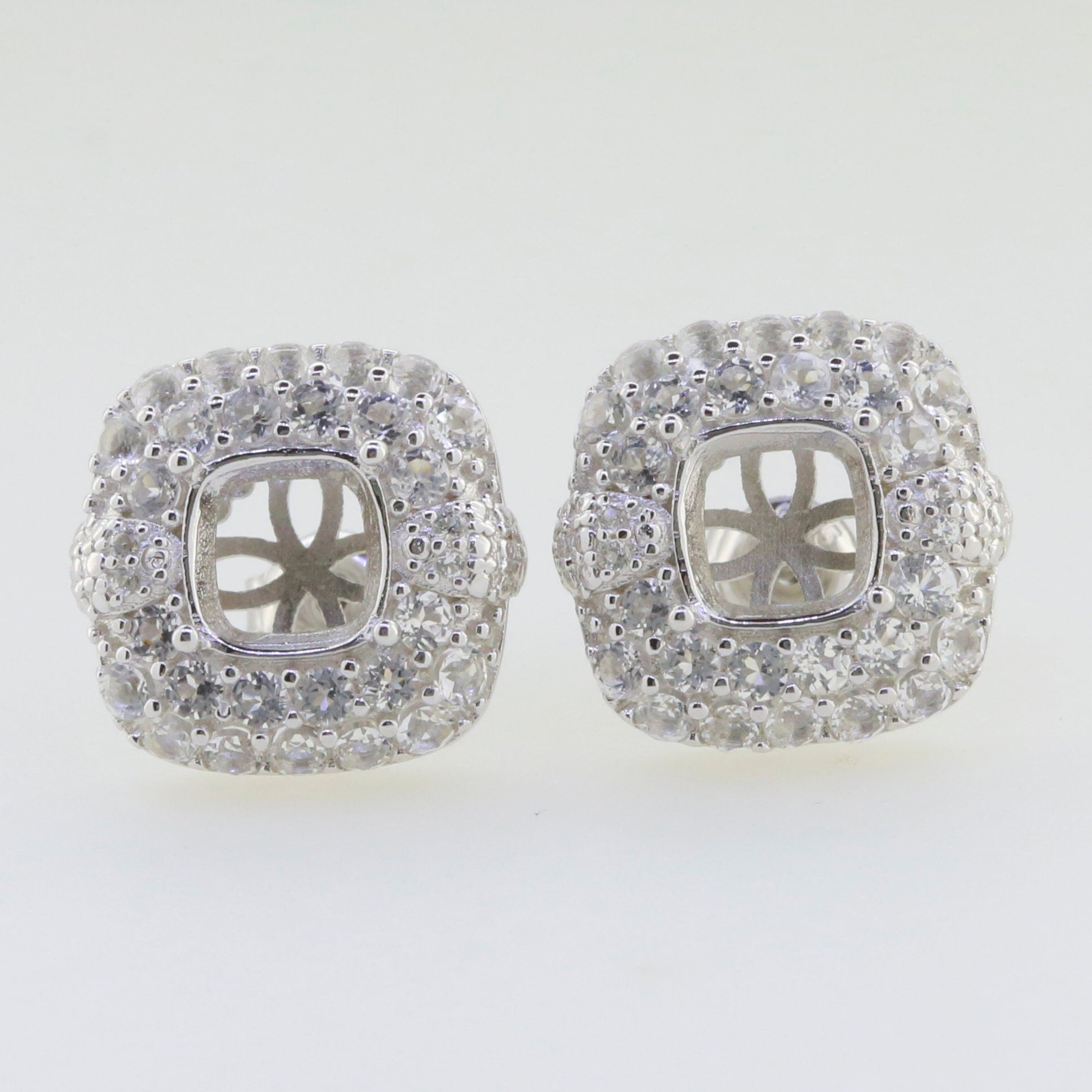 Sterling Silver Semi Mount Earrings Setting with Double Halo for Cushion Cut 7x7mm, featuring White Topaz gemstones.