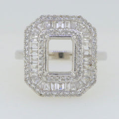 Sterling silver semi mount ring setting with emerald OCT 9x7mm and baguette triple halo design.
