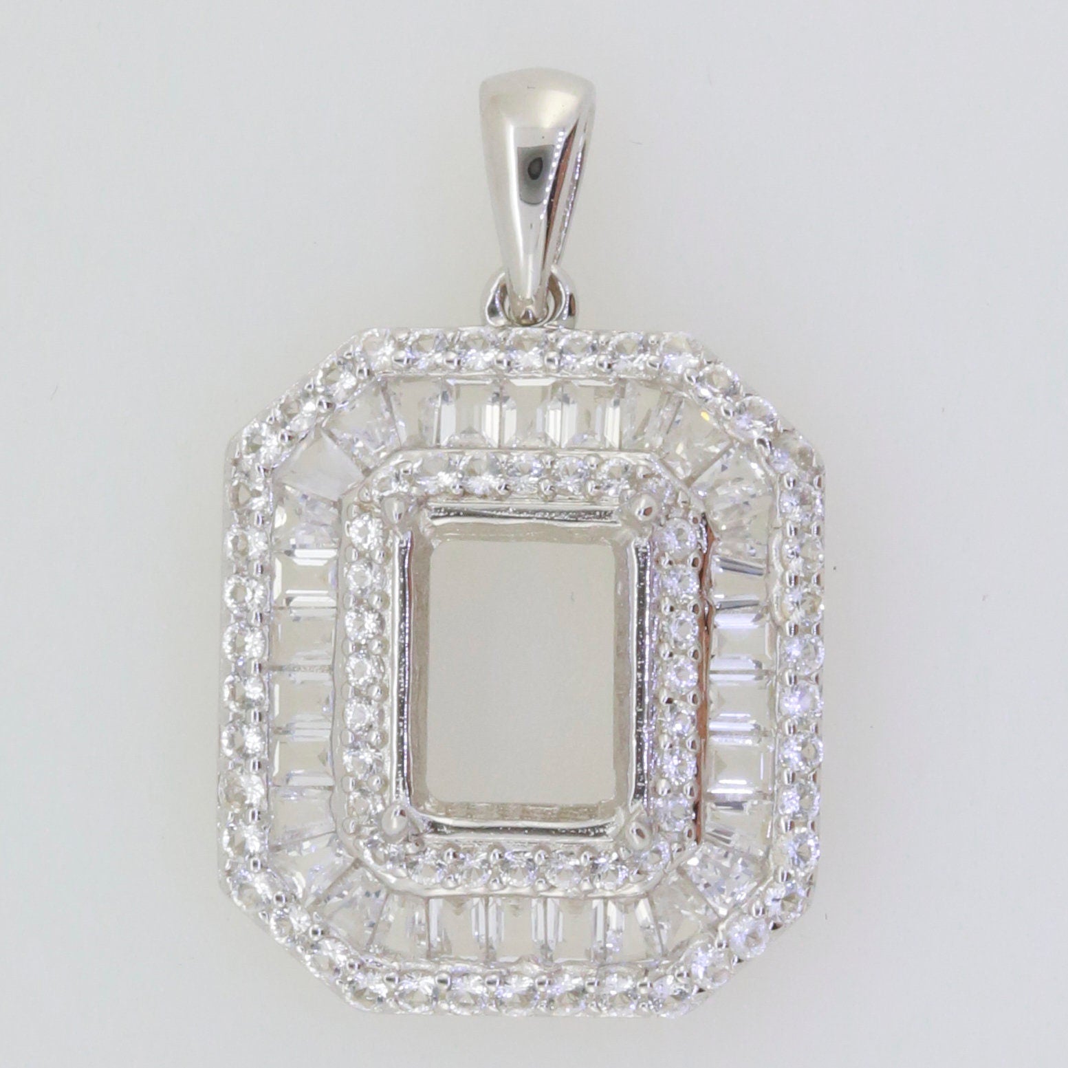 Sterling silver semi mount pendant setting with baguette and round white topaz triple halo, ready for custom gemstone.