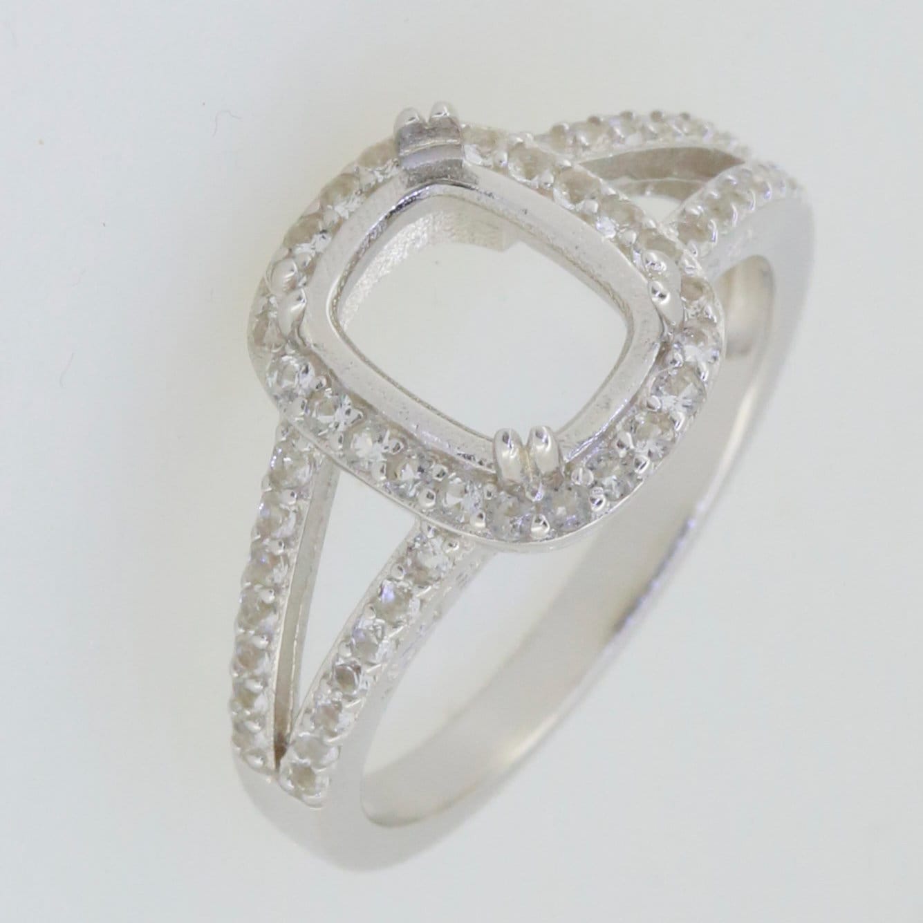 Sterling silver semi mount ring setting with cushion cut halo and split shank design for custom gemstones.