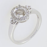 Sterling silver semi mount ring setting with D Color Moissanite accents, designed for an 8x6mm oval gemstone.