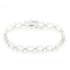 Sterling Silver Semi Mount Tennis Bracelet Setting with oval gemstone placeholders for cabochon.