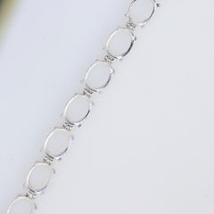 Sterling Silver Semi Mount Tennis Bracelet Setting featuring oval gemstone placeholders for custom designs.