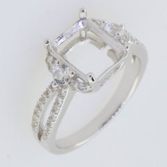 Sterling silver semi mount ring setting with moissanite accents and halo design, perfect for an emerald centerpiece.
