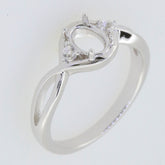 Sterling silver semi mount ring setting for 7x5mm oval gemstone with split shank design and white topaz accents.
