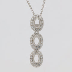 Sterling silver semi mount pendant setting with white topaz halo and three oval stones.