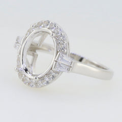 Sterling silver semi mount ring setting with oval halo design and sparkling white topaz gemstones.