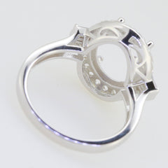 Sterling Silver semi mount ring setting with oval halo design for 12x10mm gemstone, featuring intricate detailing.