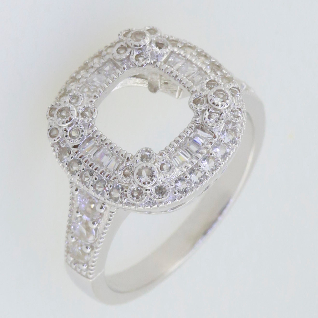 Sterling silver semi mount ring setting with cushion cut design and double halo accents featuring white topaz.