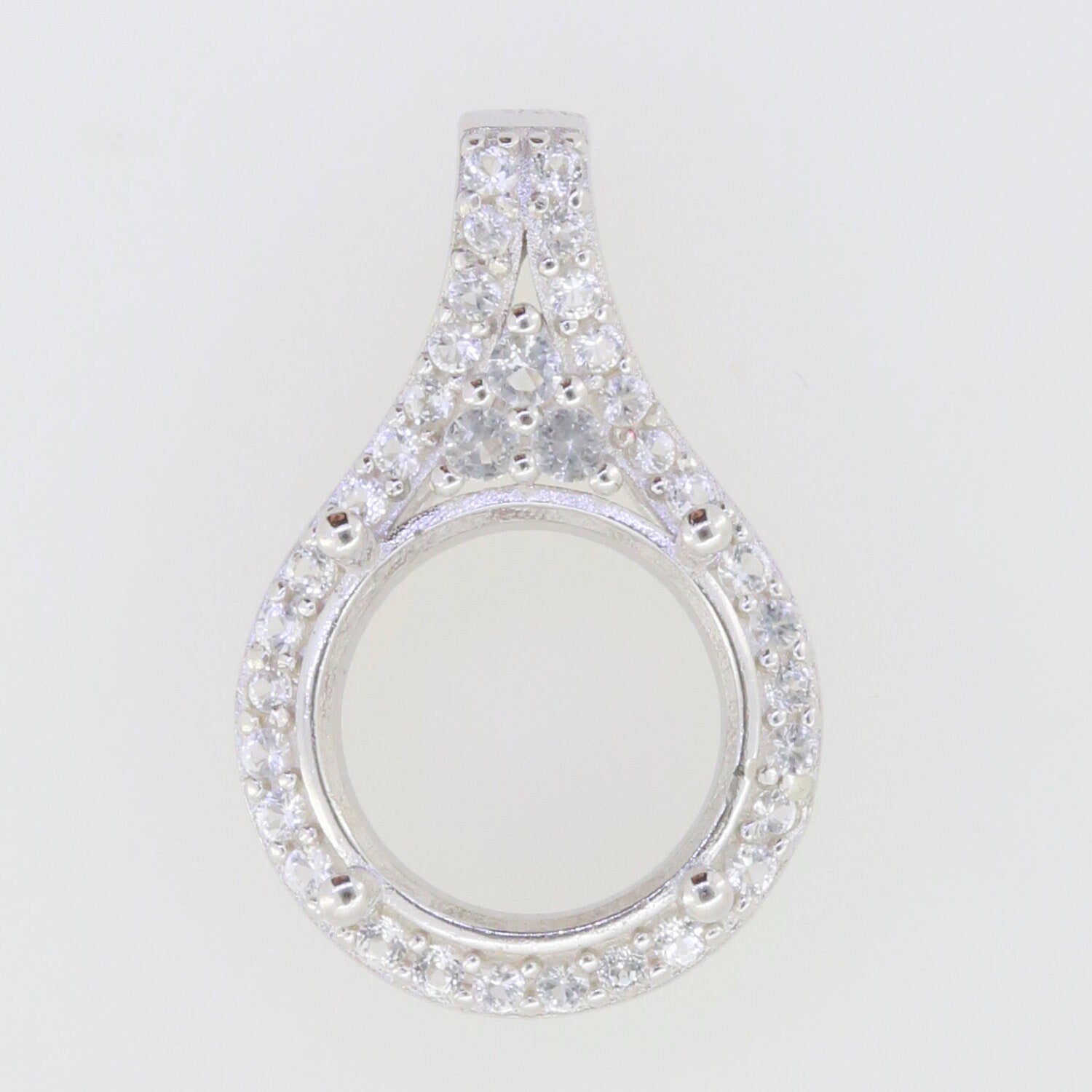 Sterling silver semi mount pendant setting with round halo of white topaz, perfect for custom gemstone placement.