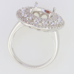 Sterling silver semi mount ring setting with triple halo design, prepared for an oval stone, showcasing white topaz accents.