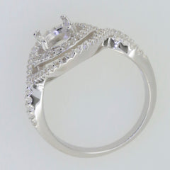 Sterling silver semi mount ring setting with oval halo and split shank design, showcasing white topaz accent.