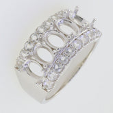 Sterling silver semi mount ring setting with oval stone placeholders and white topaz accents for multi-stone designs.
