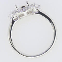 Sterling silver semi mount ring setting with D color moissanite accents and oval stone holder.
