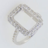 Sterling silver semi mount ring setting with halo of D Color Moissanite accents, perfect for custom gemstone placement.