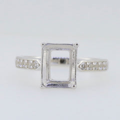 Sterling Silver semi mount ring setting with D Color Moissanite accents, designed for an 10x8mm emerald gemstone.