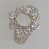 Sterling silver semi mount ring setting with oval halo floral design, perfect for custom gemstone placement.